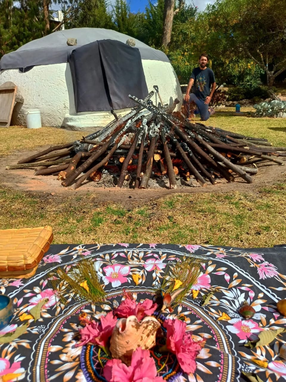 Sacred fire and altar in front of the temazcal sweat lodge at Teos